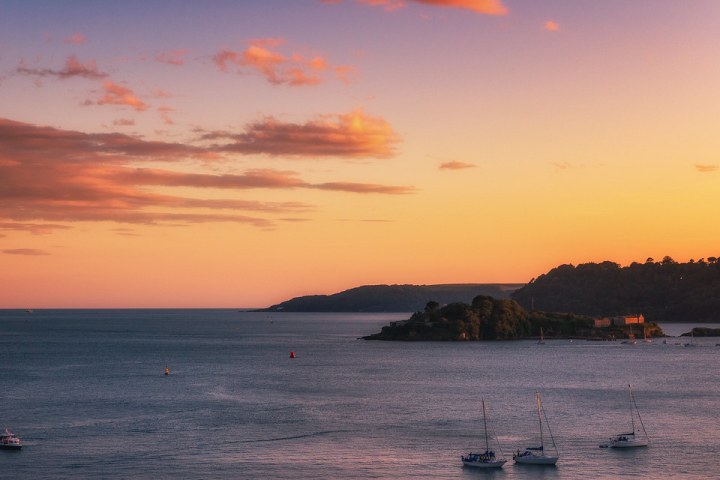 a sunset over a body of water