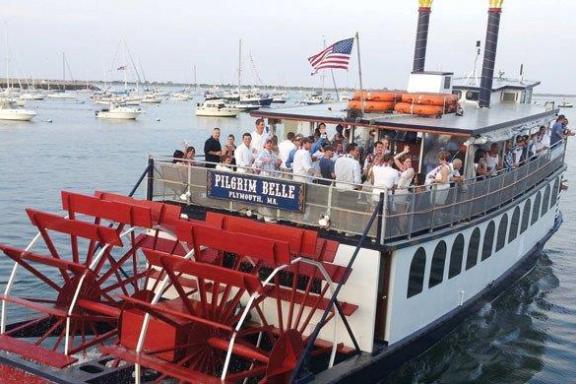 a group of people in a boat on a body of water