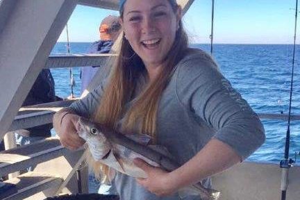 a person standing in front of a boat
