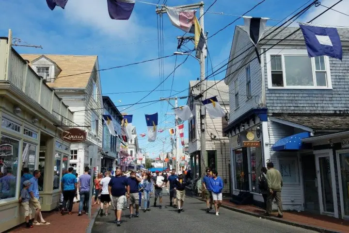 a group of people walking down a street