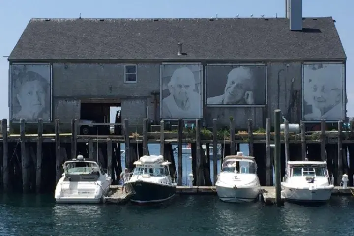 a boat is docked next to a body of water