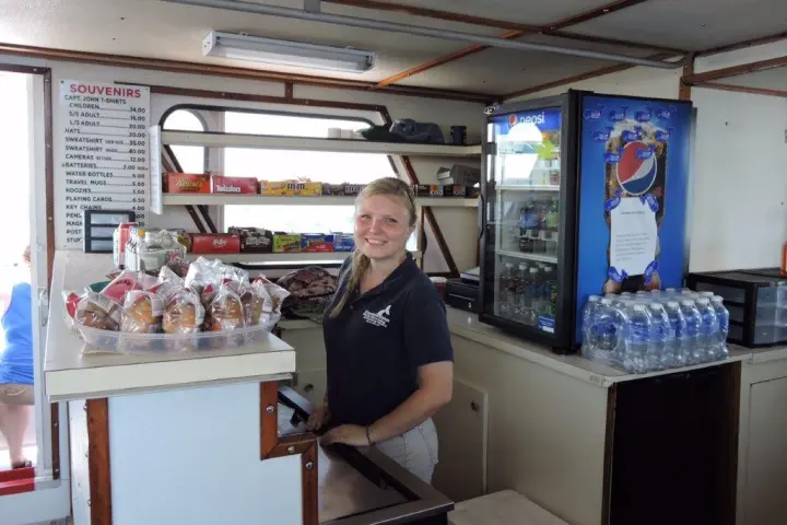 a person standing in front of a refrigerator