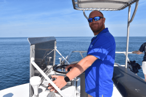 a man drinking from a boat